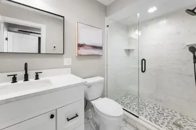 a white bathroom with a toilet and a shower at remember2giggle at gee mail to discuss and inquire in Avon