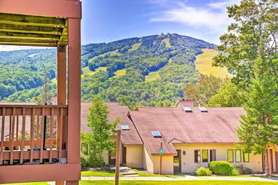 a house with a view of a mountain at Snow Mountain Condo Hot Tub and Shuttle to Resort in West Dover