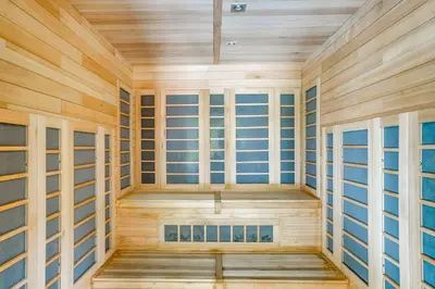 an empty sauna with wooden walls and windows at Snow Mountain Condo Hot Tub and Shuttle to Resort in West Dover