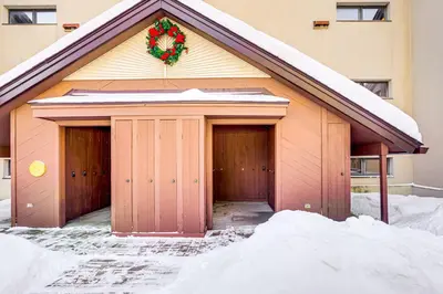 a garage with a christmas wreath on top of it at Snow Mountain Condo Hot Tub and Shuttle to Resort in West Dover