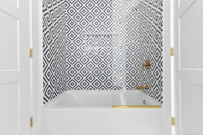 a bathroom with a white and black tiled wall at Stareway to Heaven in Fairfield
