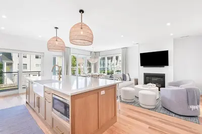 a kitchen and living room with a fireplace and a tv at Stareway to Heaven in Fairfield