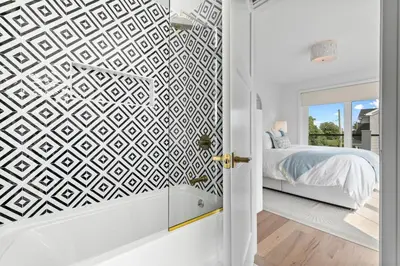a bedroom with a bed and a geometric wallpaper at Stareway to Heaven in Fairfield
