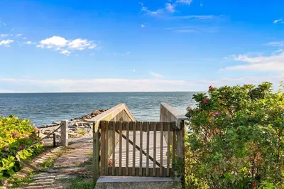a wooden gate leading to the ocean on a beach at Stareway to Heaven in Fairfield