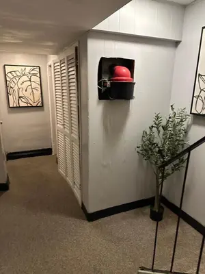 a hallway with a red ball in a box on the wall at Your Home away from Home ! in Baychester