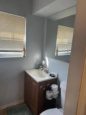 a bathroom with a sink and a toilet at Your Home away from Home ! UNIT 2- 1st floor in Baychester