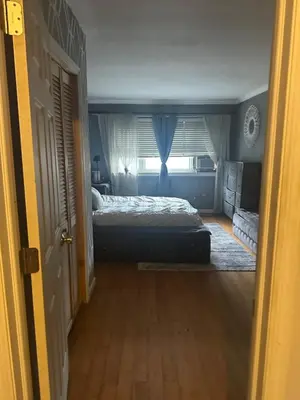a bedroom with a bed and a window at Your Home away from Home ! UNIT 2- 1st floor in Baychester
