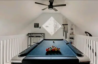 a pool table in a room with a ceiling fan at Modern Pine Tree Chalet with HOT TUB, Outdoor TV, VIEWS, Games & POOL 5 mins away!! in Gilboa