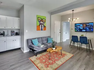 a living room with a couch and a table at Elegant Retreat Where Relaxation Embraces Design in Springfield
