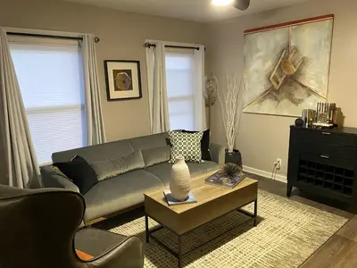 a living room with a couch and a coffee table at Wooster Square Gems in New Haven