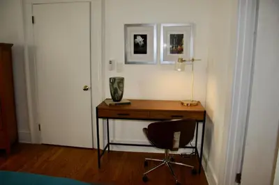 a room with a desk and a chair and a door at Wooster Square Gems in New Haven