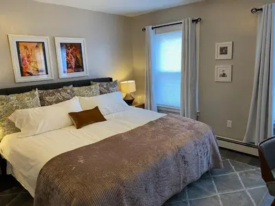 a bedroom with a large bed and a window at Wooster Square Gems in New Haven