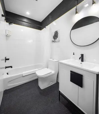 a bathroom with a sink and a toilet and a tub at 2C - Parking Cred, Early CI, King Bed, Sleeps 6 - 30mins to NYC in Newark
