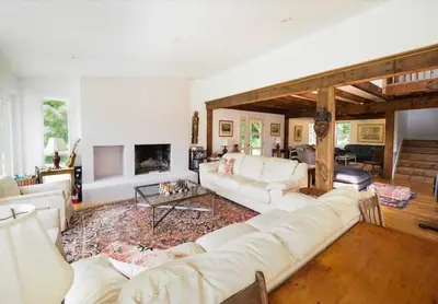 a living room with white furniture and a fireplace at Charming 6 Bdrm Countryside Stay, Sauna and HotTub in North Egremont