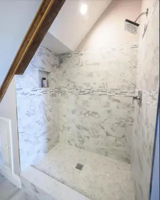 a bathroom with a shower with white stone walls at Charming 6 Bdrm Countryside Stay, Sauna and HotTub in North Egremont