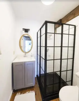a bathroom with a mirror and a sink at Charming 6 Bdrm Countryside Stay, Sauna and HotTub in North Egremont