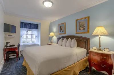 a hotel room with a large bed and a desk at 3 West Club in New York