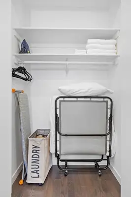a walk in closet with a cart in a room at SWJ 4 - 25 Min to Times Sq Save on 2Day Stays in New York
