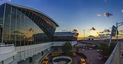 a large building with cars parked in a parking lot at SWJ 4 - 25 Min to Times Sq Save on 2Day Stays in New York