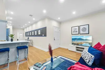 a living room with a couch and a table at SWJ544FH Huge 6BR 4BA Backyard Access in New York