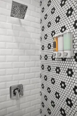 a bathroom with a shower with black and white tiles at SWJ544FH Huge 6BR 4BA Backyard Access in New York