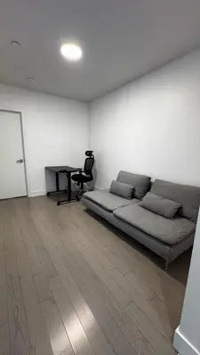 a room with a bed and a desk in it at Beautiful Bedroom with Attached Bathroom, 15 minutes from NYC in West New York