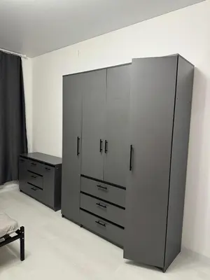 a bedroom with two white cabinets and a bed at Chic and Sparkle in Beacon
