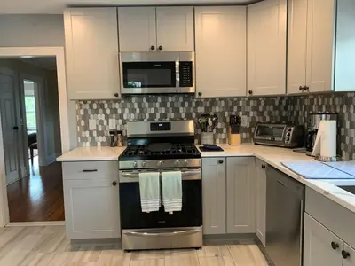a kitchen with a stove and a microwave at Lovely 1 BD downtown 2F apt in quite neighborhood in Montclair