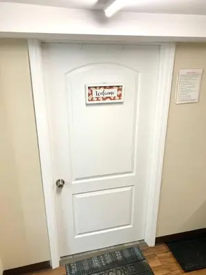 a white door with a sign on it at Semi Private cozy studio near downtown. in Montclair