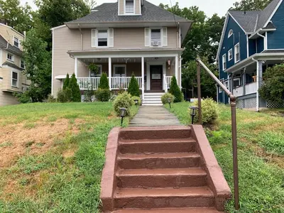 a house with a walkway in front of a house at Semi Private cozy studio near downtown. in Montclair