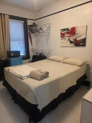 a bedroom with a large bed in a room at Woodside room in Sunnyside