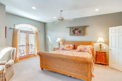 a bedroom with a bed and a window at Less Than 1 Mi to Hunter Mtn Spacious Home with Hot Tub! in Lanesville
