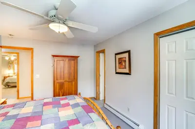 a bedroom with a ceiling fan and a bed at Less Than 1 Mi to Hunter Mtn Spacious Home with Hot Tub! in Lanesville