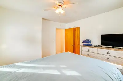 a bedroom with a bed and a flat screen tv at 4 Mi to Dtwn Pet-Friendly Home in Utica in Utica
