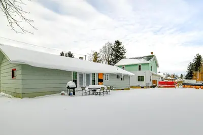 a house with a white awning in the snow at 4 Mi to Dtwn Pet-Friendly Home in Utica in Utica