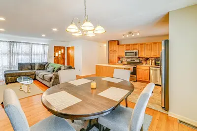 a kitchen and living room with a table and chairs at 4 Mi to Dtwn Pet-Friendly Home in Utica in Utica