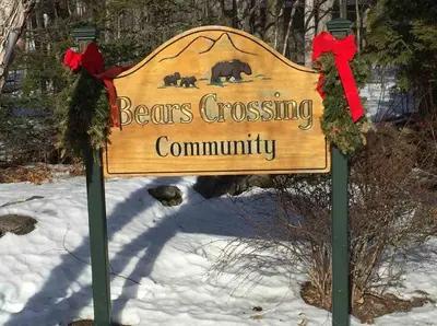 a sign for a bears crossing community in the snow at 2BD 1BA - Mount Snow VT - Ski-Back Trail - Shuttle in Dover