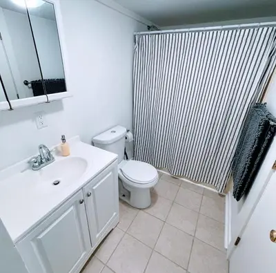 a bathroom with a white sink and a toilet at 2BD 1BA - Mount Snow VT - Ski-Back Trail - Shuttle in Dover