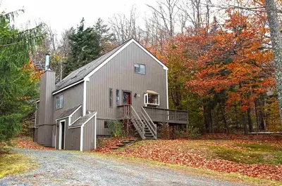 a large gray barn in the middle of a road at 2BD 1BA - Mount Snow VT - Ski-Back Trail - Shuttle in Dover