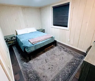 a bedroom with a bed in a room with a window at 2BD 1BA - Mount Snow VT - Ski-Back Trail - Shuttle in Dover