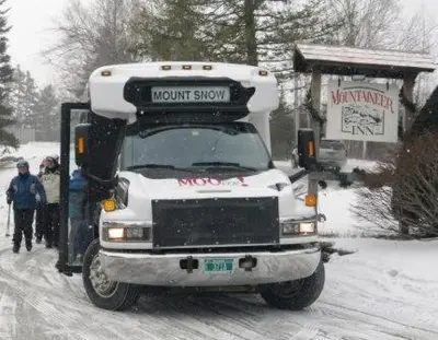 a snow covered truck parked on a snow covered road at 2BD 1BA - Mount Snow VT - Ski-Back Trail - Shuttle in Dover