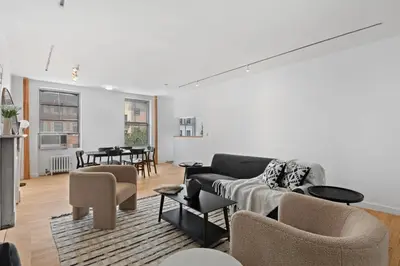 a living room with a couch and chairs and a table at Chelsea Canvas III by Rove Travel Charming 2BR Gem in New York