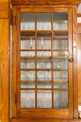 a glass cabinet with glasses in it at Beechmont-Charming Colonial for Events and Getaways! in Bridgeport