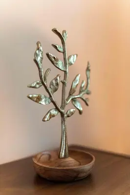 a small bronze tree in a bowl on a table at Beechmont-Charming Colonial for Events and Getaways! in Bridgeport