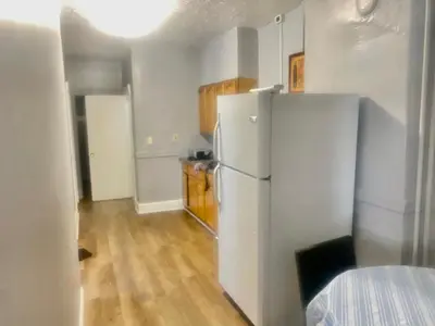 a kitchen with a white refrigerator in a room at SouthGreen APT 2S in Hartford