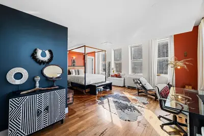 a living room with a bed and a mirror at Broadway Terrace by Rove Loft with Private Terrace in New York