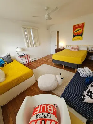 a room with two beds and a couch in it at New- Farm view-Winter escape with cozy fireplace in Lake Katrine