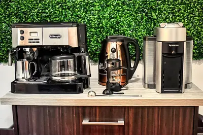 a coffeemaker and a coffee maker on a counter at Spacious Cozy Retreat, Sleeps 10, Near NYC & EWR in Newark
