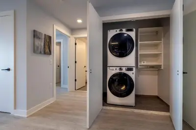 a laundry room with a washer and dryer at Chic Apt with Indoor Pool & Gym-333-2509 in New Rochelle