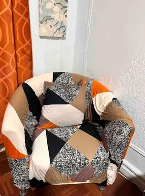 a comforter on top of a bed in a room at Large and spacious room facing a beautiful park minutes away from Manhattan in High Bridge